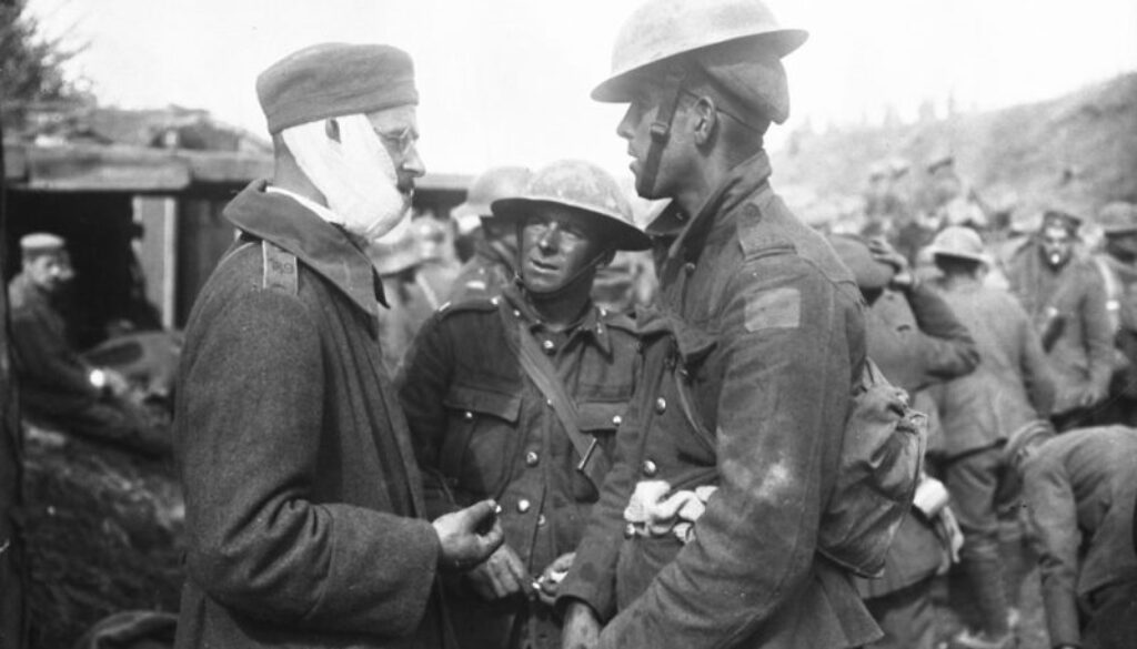 272_Canadian talking to English speaking German at Advanced Dressing Station. Advance East of Arras. October, 1918.